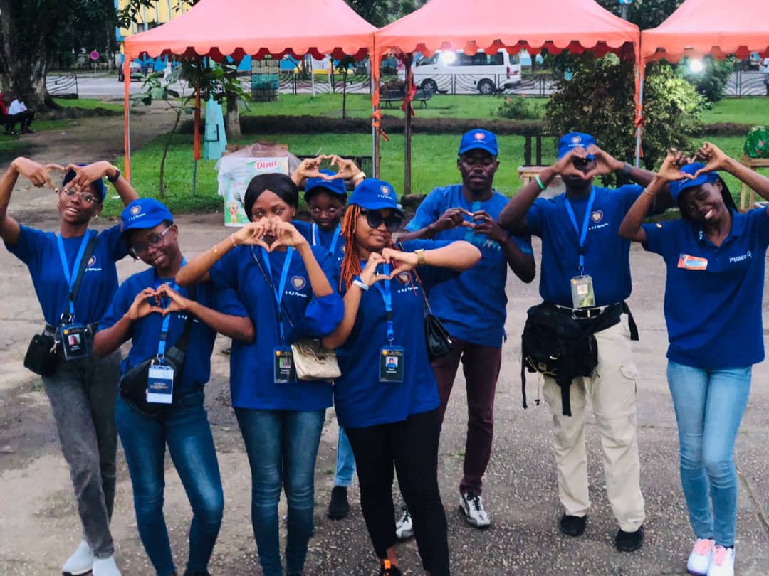 full team posing with hands forming heart symbols